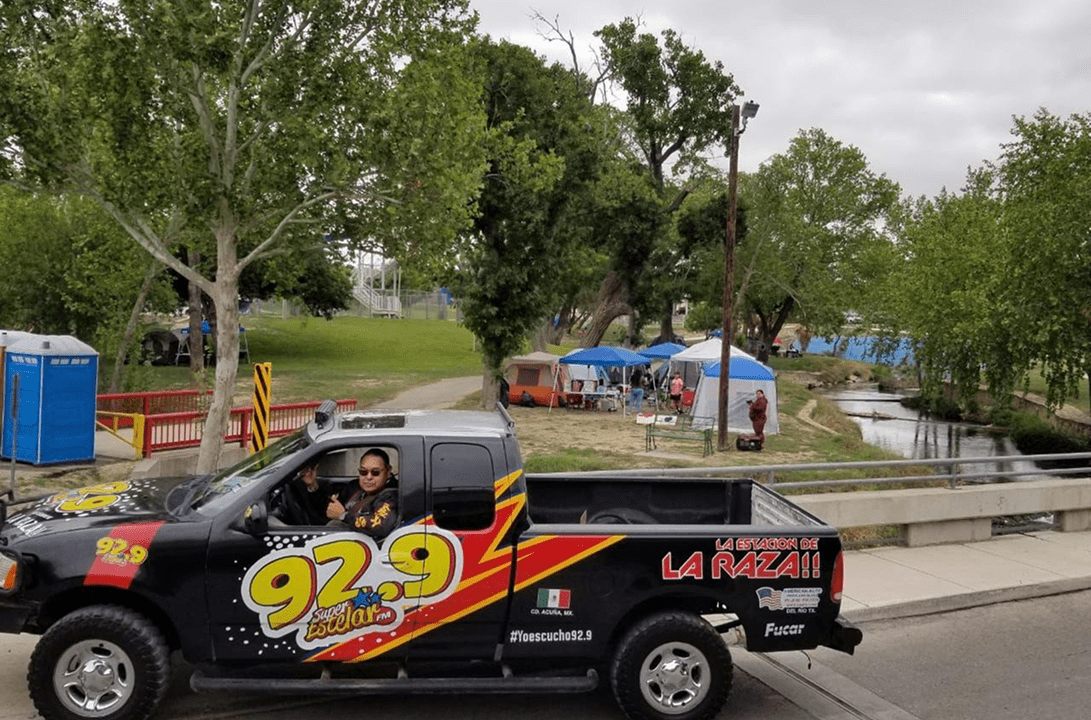 92.9 La Raza truck by riverside tents