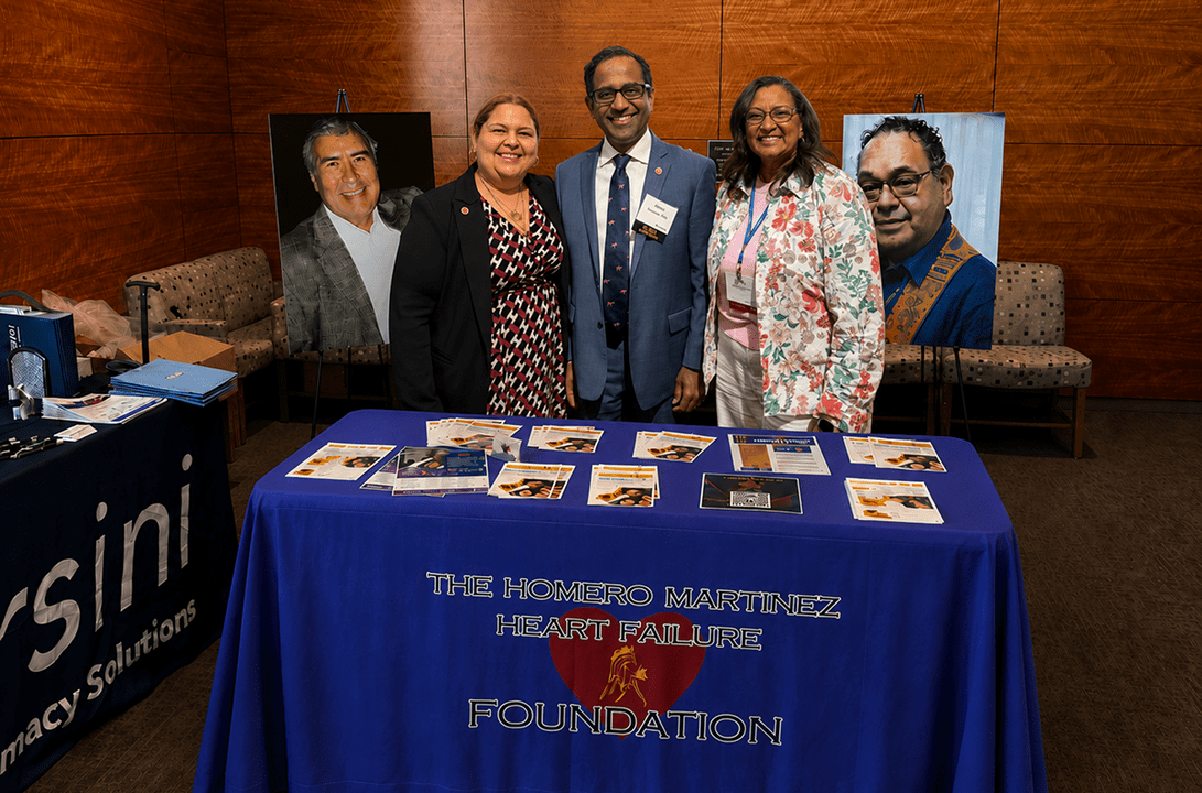 Three people at heart failure foundation table